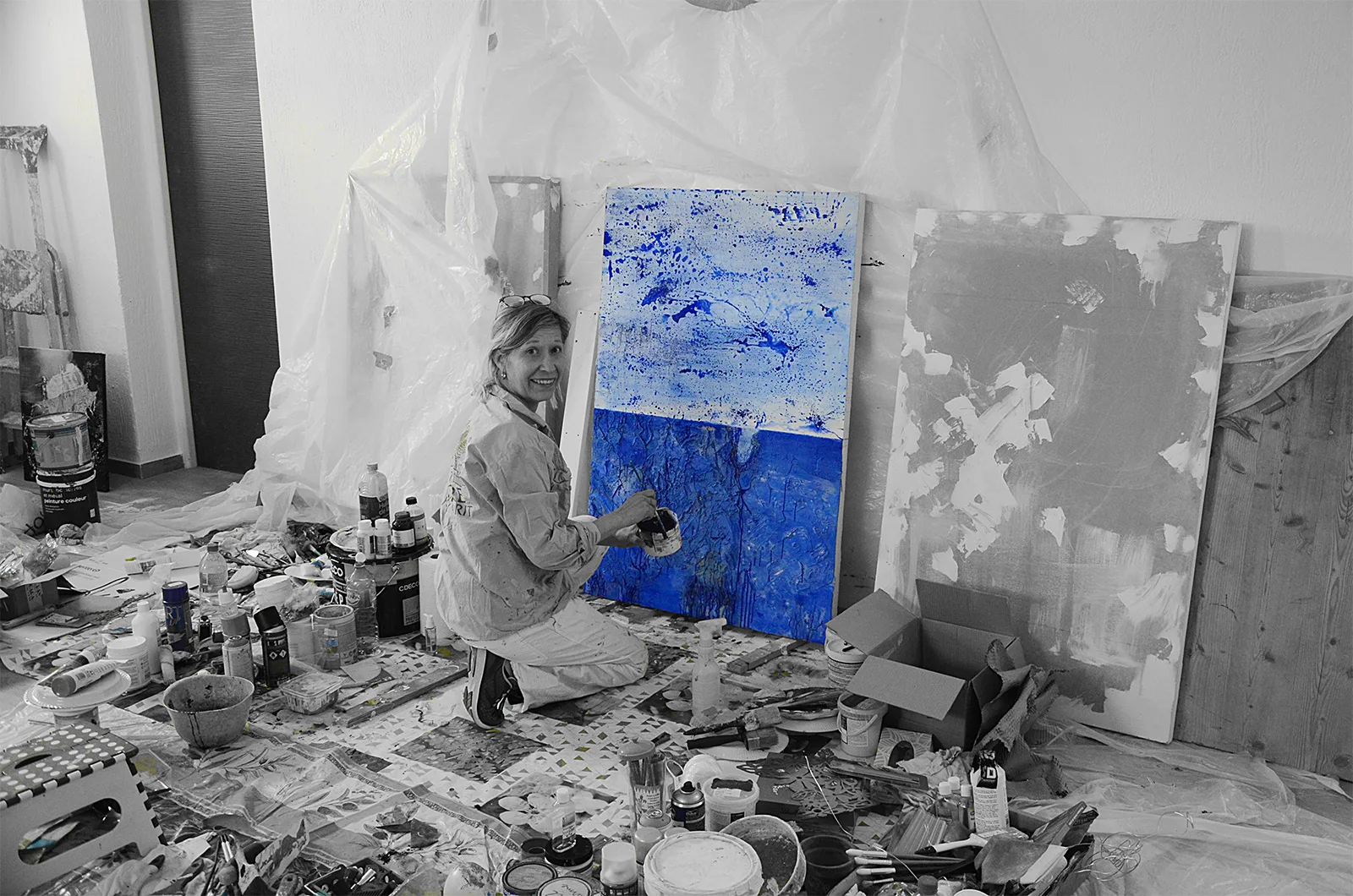 Benie painting in her workshop black and white picture